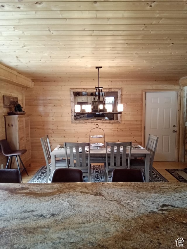 2204 S Timber Lakes Dr S Unit 945, Heber City, UT 84032 - unfurnished dining area with wood ceiling, a notable chandelier, wood walls, and wood finished floors