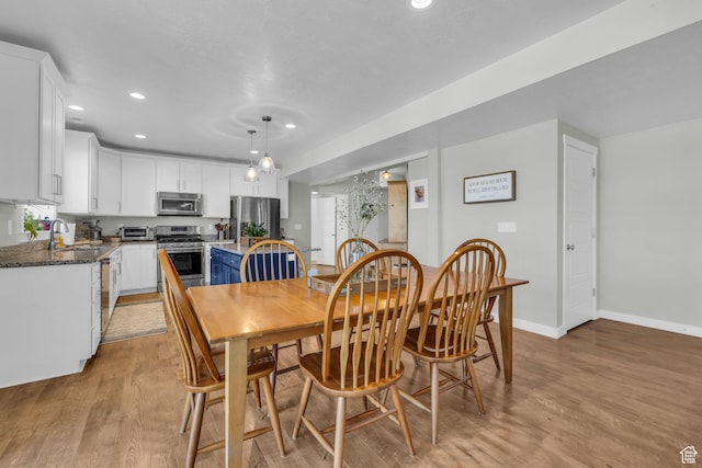 2685 E White Birch Dr, Eagle Mountain, UT 84005 - dining room featuring recessed lighting, baseboards, and light wood finished floors