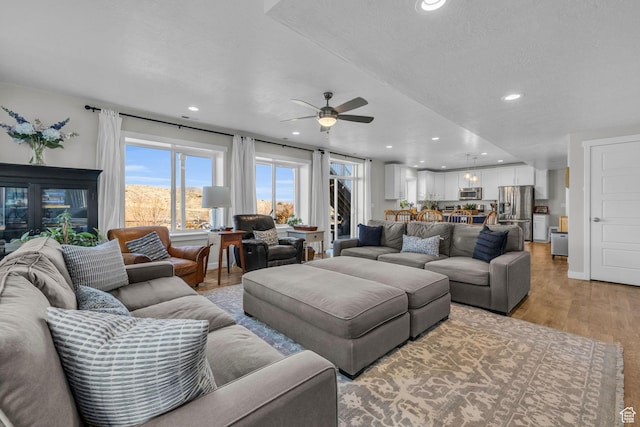 2685 E White Birch Dr, Eagle Mountain, UT 84005 - living area with recessed lighting, a ceiling fan, and light wood-type flooring
