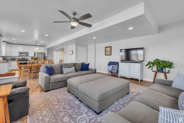 2685 E White Birch Dr, Eagle Mountain, UT 84005 - living room with light wood-type flooring, a ceiling fan, recessed lighting, and baseboards
