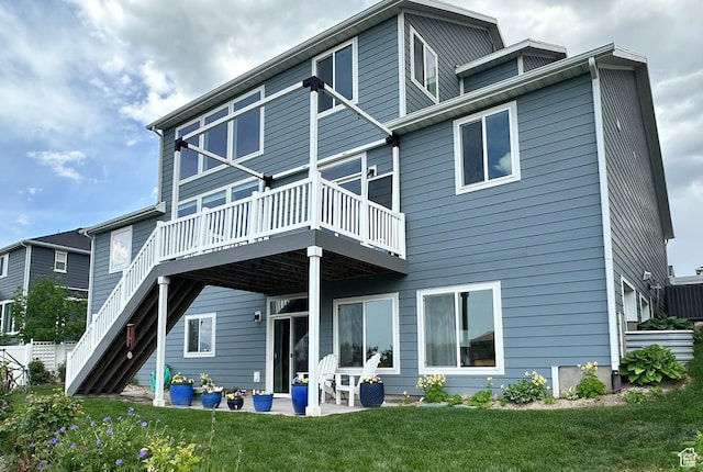 2685 E White Birch Dr, Eagle Mountain, UT 84005 - back of house featuring a deck, a yard, stairway, and a patio area