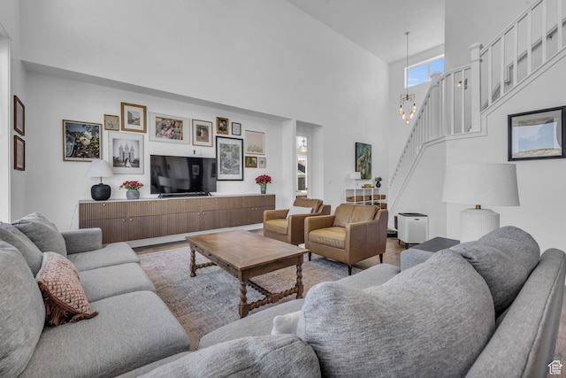 2685 E White Birch Dr, Eagle Mountain, UT 84005 - living room with stairway, wood finished floors, and a high ceiling