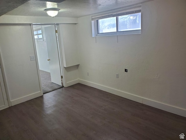 397 E 200 N, Kaysville, UT 84037 - unfurnished bedroom featuring a textured ceiling, dark wood-style floors, baseboards, and a closet