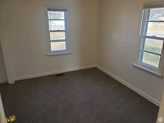 397 E 200 N, Kaysville, UT 84037 - empty room with plenty of natural light, baseboards, and dark colored carpet