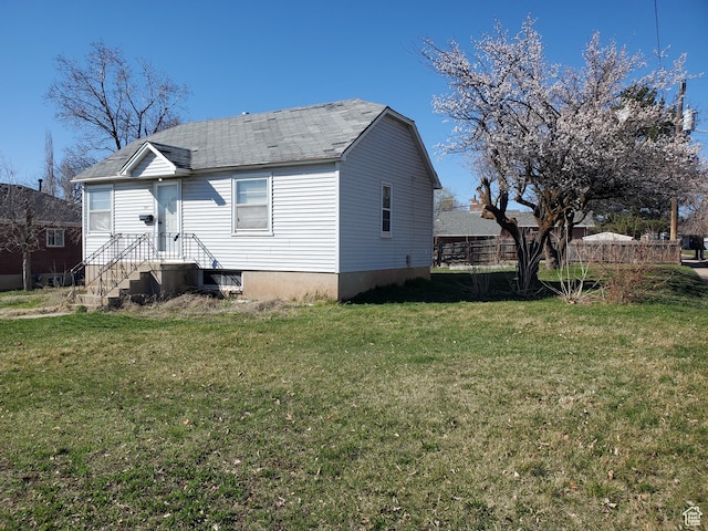 397 E 200 N, Kaysville, UT 84037 - rear view of house with a shingled roof and a yard