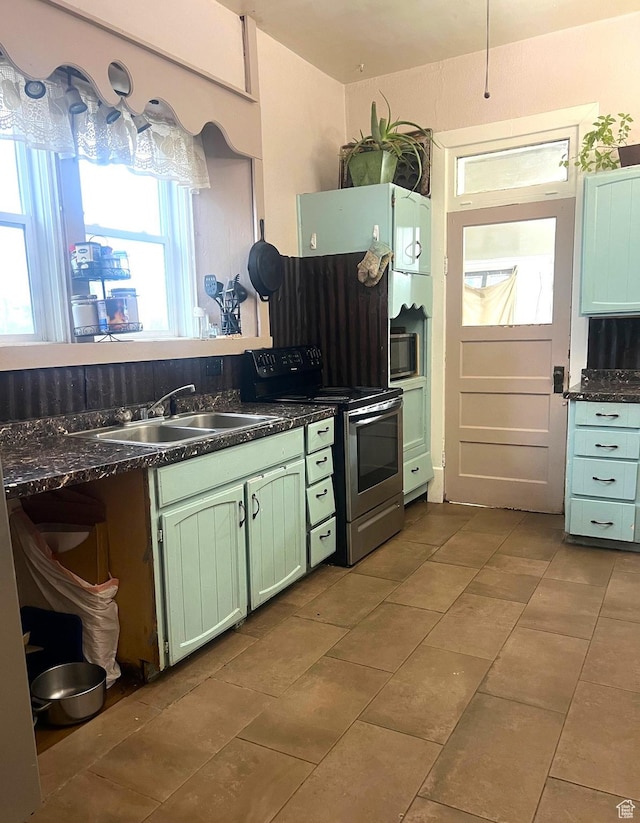 316 W 500 N, Beaver, UT 84713 - kitchen with green cabinets, dark countertops, tile patterned floors, appliances with stainless steel finishes, and a sink