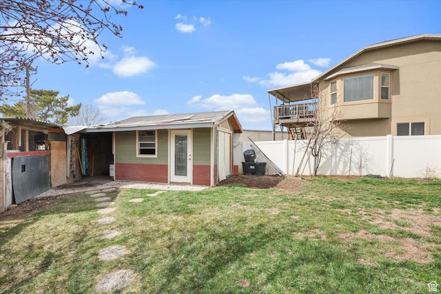 3018 S Asplund Cir, Salt Lake City, UT 84119 - rear view of house featuring stucco siding and fence