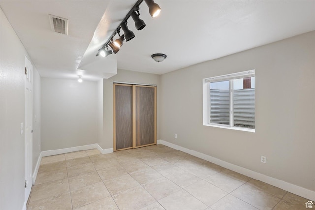 3018 S Asplund Cir, Salt Lake City, UT 84119 - empty room with light tile patterned floors, baseboards, and visible vents