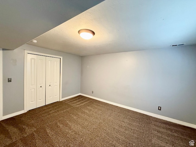 6991 S Canyon Pines Cir E, Cottonwood Heights, UT 84121 - unfurnished bedroom with a closet, carpet flooring, a textured ceiling, visible vents, and baseboards
