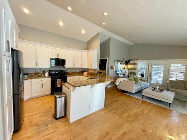 6991 S Canyon Pines Cir E, Cottonwood Heights, UT 84121 - kitchen with a sink, white cabinetry, black appliances, and open floor plan