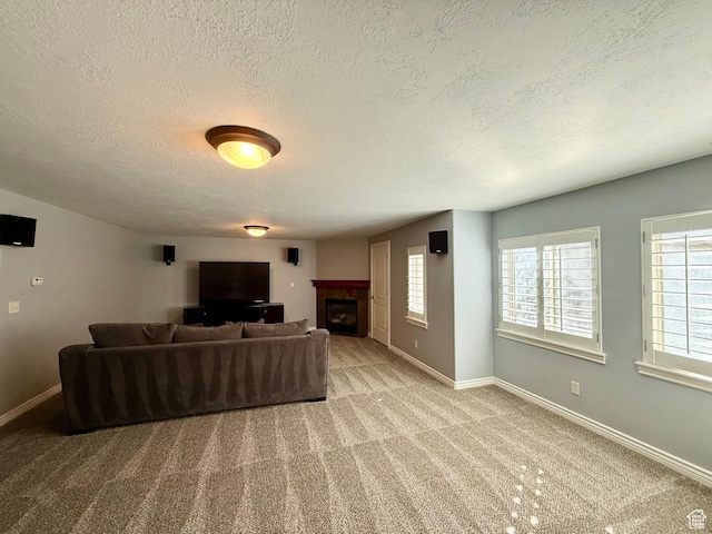 6991 S Canyon Pines Cir E, Cottonwood Heights, UT 84121 - carpeted living room with baseboards, a fireplace, and a textured ceiling