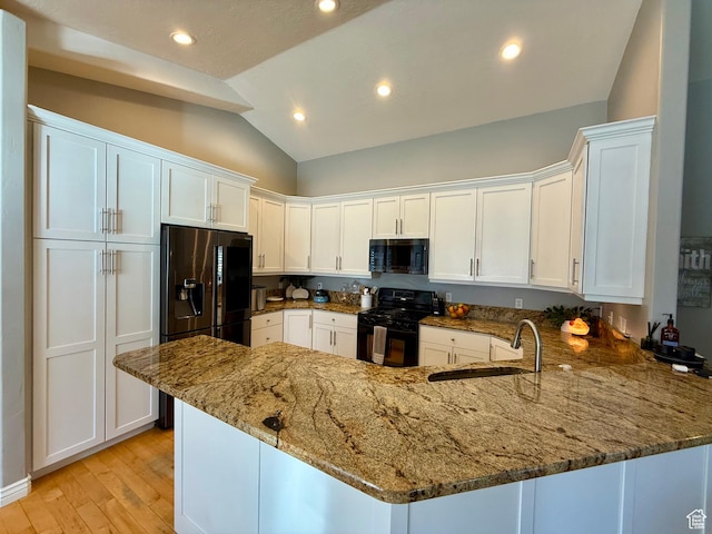 6991 S Canyon Pines Cir E, Cottonwood Heights, UT 84121 - kitchen featuring a sink, white cabinetry, a peninsula, lofted ceiling, and black appliances