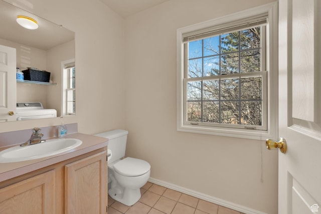882 Schneitter Cir, Midway, UT 84049 - half bathroom with washer / clothes dryer, toilet, plenty of natural light, and tile patterned floors