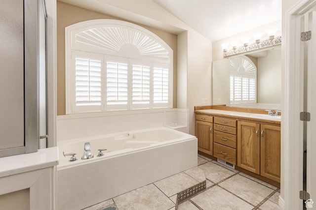 414 S 3130 W, Vernal, UT 84078 - bathroom with lofted ceiling, a garden tub, tile patterned flooring, and vanity