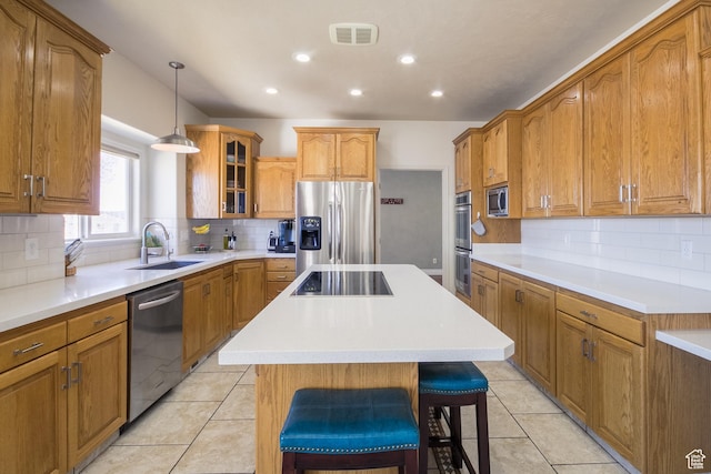 414 S 3130 W, Vernal, UT 84078 - kitchen featuring a sink, a kitchen island, appliances with stainless steel finishes, glass insert cabinets, and visible vents
