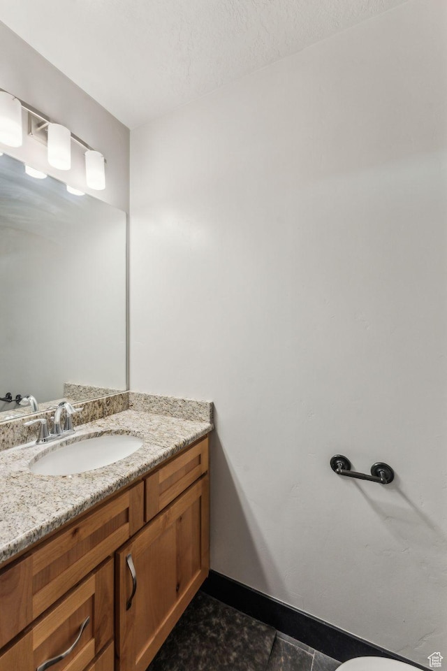 483 N 2650 W Unit 6, Tremonton, UT 84337 - bathroom with baseboards and vanity
