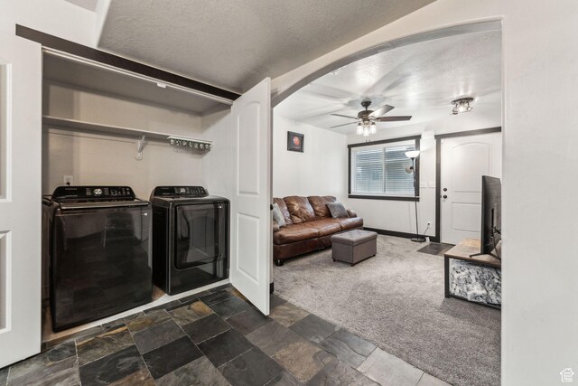 483 N 2650 W Unit 6, Tremonton, UT 84337 - washroom with stone finish floor, arched walkways, a ceiling fan, washing machine and dryer, and laundry area