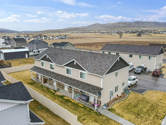 birds eye view of property with a mountain view and a residential view