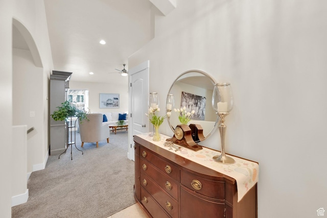 hallway with light colored carpet, baseboards, and recessed lighting