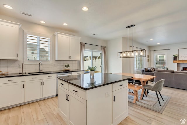 2022 E 970 N, Spanish Fork, UT 84660 - kitchen with a sink, light wood-style floors, tasteful backsplash, a center island, and recessed lighting