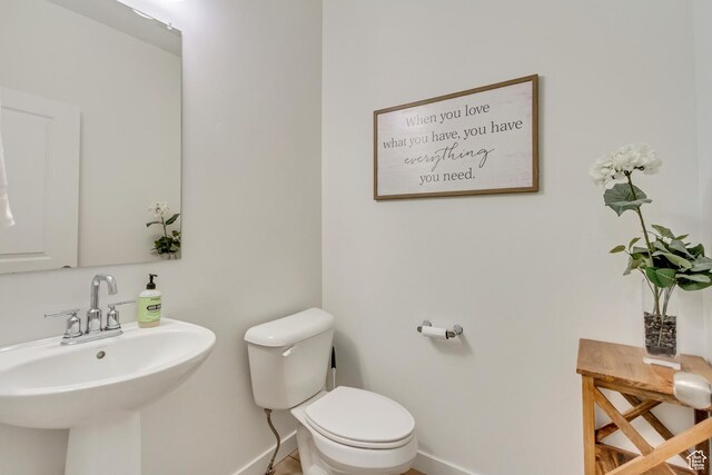 2022 E 970 N, Spanish Fork, UT 84660 - bathroom featuring baseboards, a sink, and toilet