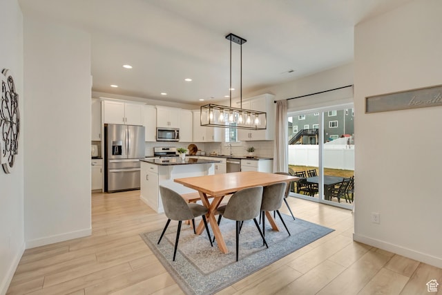 2022 E 970 N, Spanish Fork, UT 84660 - dining space featuring light wood finished floors, baseboards, and recessed lighting