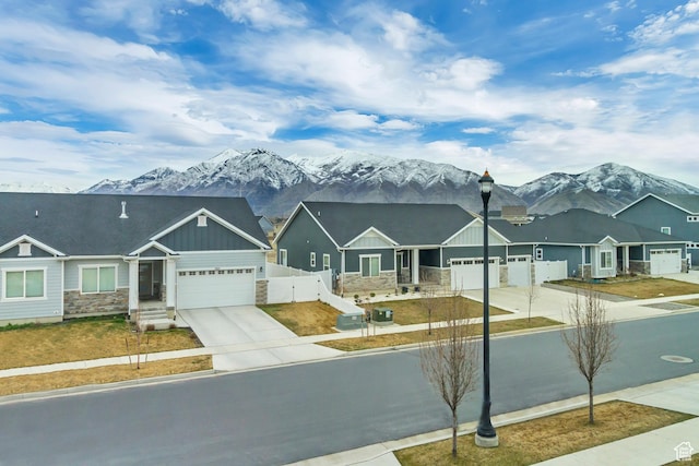 2022 E 970 N, Spanish Fork, UT 84660 - view of front facade with stone siding, driveway, board and batten siding, and a garage