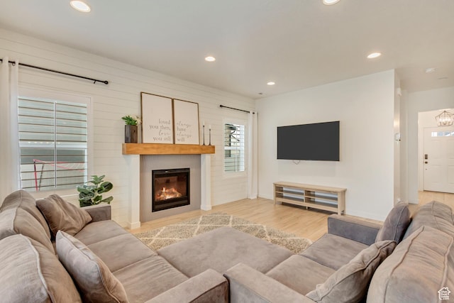 2022 E 970 N, Spanish Fork, UT 84660 - living room featuring recessed lighting, a glass covered fireplace, light wood-type flooring, and baseboards