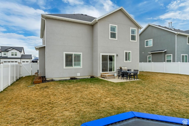 2022 E 970 N, Spanish Fork, UT 84660 - back of property with stucco siding, a patio area, and a gate