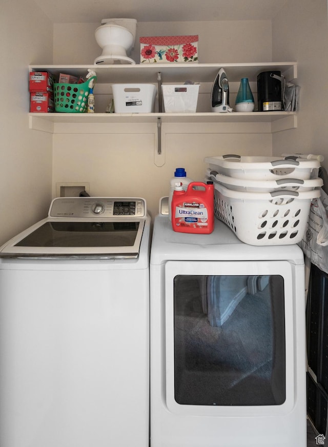 laundry room with washing machine and dryer and laundry area