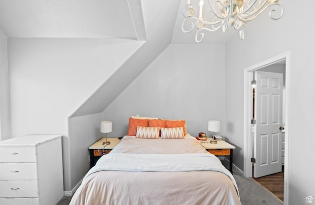 bedroom featuring baseboards, vaulted ceiling, carpet, and an inviting chandelier