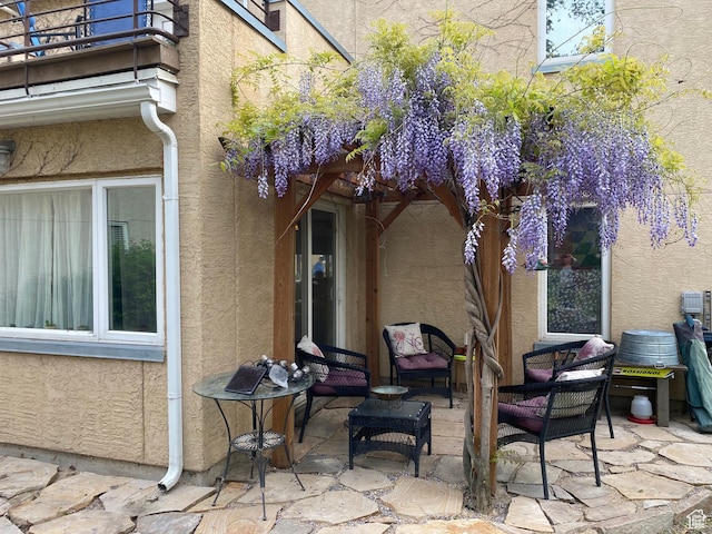 view of patio with a balcony