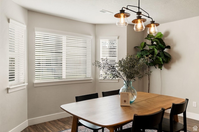 259 W 40 N, Hyrum, UT 84319 - dining area featuring dark wood finished floors, baseboards, and healthy amount of natural light