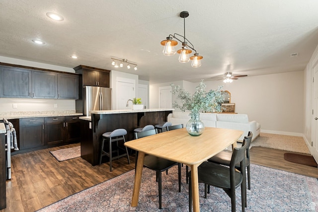 259 W 40 N, Hyrum, UT 84319 - dining space with a textured ceiling, ceiling fan, dark wood-style floors, recessed lighting, and baseboards
