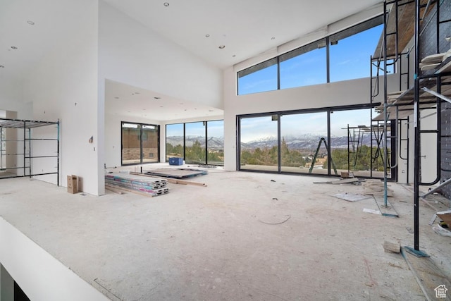 2220 E Flat Top Mountain Dr, Heber City, UT 84032 - unfurnished living room with a high ceiling and a mountain view