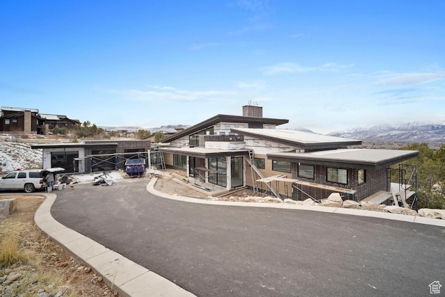 2220 E Flat Top Mountain Dr, Heber City, UT 84032 - view of front of house featuring a mountain view, a chimney, and brick siding