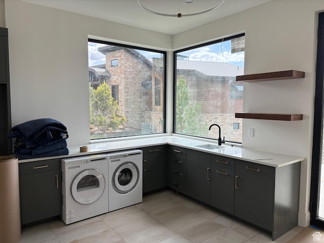 2220 E Flat Top Mountain Dr, Heber City, UT 84032 - laundry area with washer and clothes dryer, healthy amount of natural light, cabinet space, and light tile patterned floors