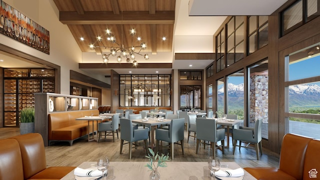 2220 E Flat Top Mountain Dr, Heber City, UT 84032 - dining area with high vaulted ceiling, wood finished floors, a chandelier, a mountain view, and beamed ceiling