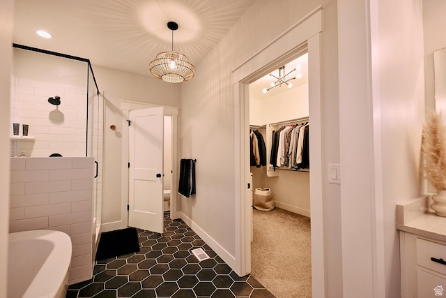 6889 W Lake Ave, South Jordan, UT 84009 - full bathroom with toilet, a tub to relax in, a spacious closet, walk in shower, and baseboards