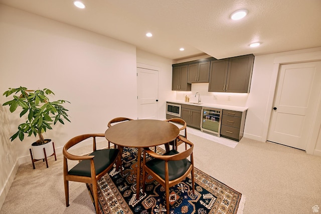 6889 W Lake Ave, South Jordan, UT 84009 - dining room with recessed lighting, wine cooler, baseboards, light carpet, and indoor wet bar