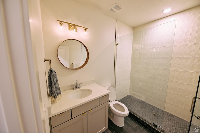 6889 W Lake Ave, South Jordan, UT 84009 - bathroom with vanity, a tile shower, recessed lighting, toilet, and visible vents