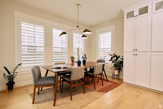 6889 W Lake Ave, South Jordan, UT 84009 - dining space featuring baseboards and light wood finished floors