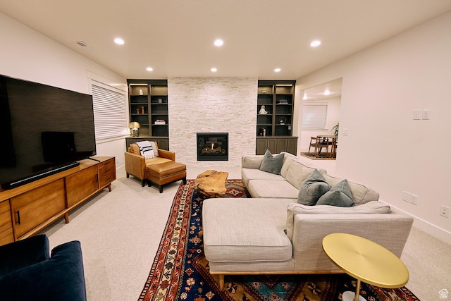 6889 W Lake Ave, South Jordan, UT 84009 - living area with a stone fireplace, recessed lighting, carpet, and built in shelves