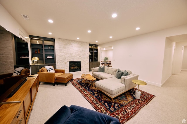 6889 W Lake Ave, South Jordan, UT 84009 - living room with light colored carpet, recessed lighting, baseboards, visible vents, and a fireplace