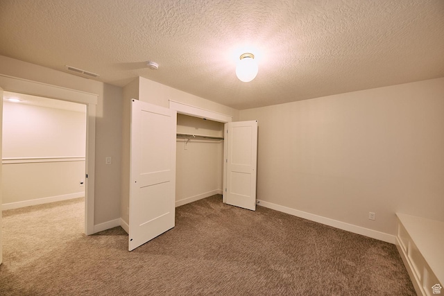 6889 W Lake Ave, South Jordan, UT 84009 - unfurnished bedroom with a closet, a textured ceiling, visible vents, baseboards, and carpet floors