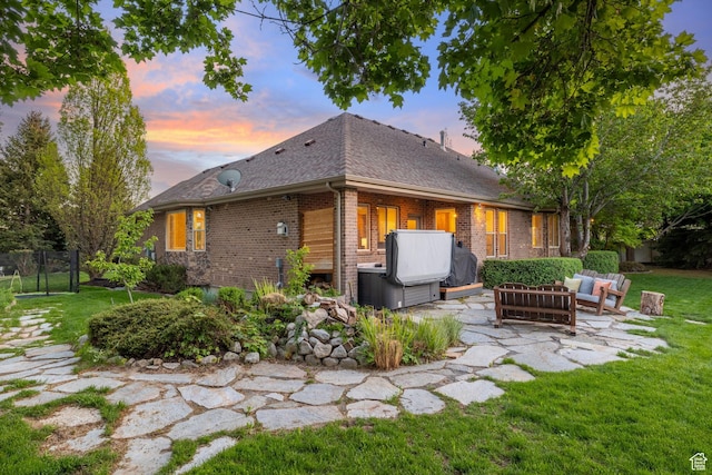 6208 W Bull River Rd, Highland, UT 84003 - back of house with outdoor lounge area, a patio, brick siding, and a shingled roof
