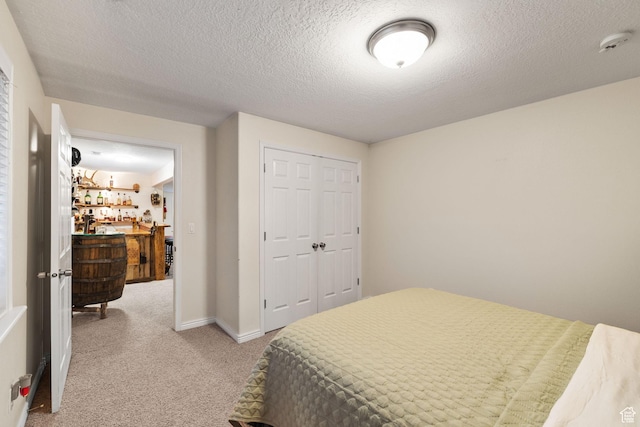 6208 W Bull River Rd, Highland, UT 84003 - bedroom with light colored carpet, a closet, a textured ceiling, and baseboards