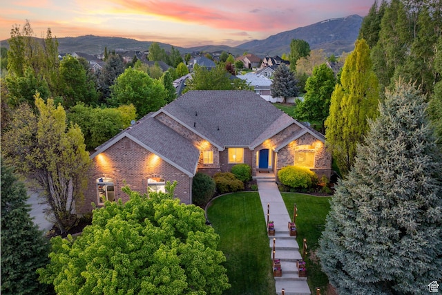 6208 W Bull River Rd, Highland, UT 84003 - view of front of house featuring brick siding, a mountain view, and roof with shingles