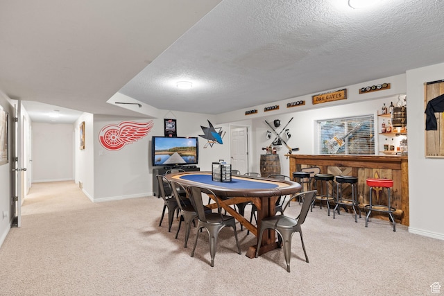 6208 W Bull River Rd, Highland, UT 84003 - dining room with a bar, a textured ceiling, light carpet, and baseboards