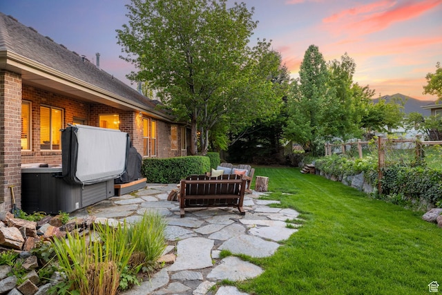 6208 W Bull River Rd, Highland, UT 84003 - view of green lawn featuring a hot tub, an outdoor living space, and a patio area
